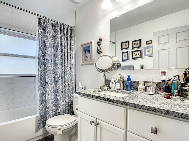 full bathroom featuring shower / bathtub combination with curtain, toilet, and vanity