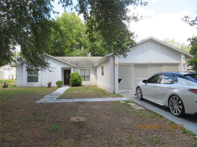 single story home featuring a garage