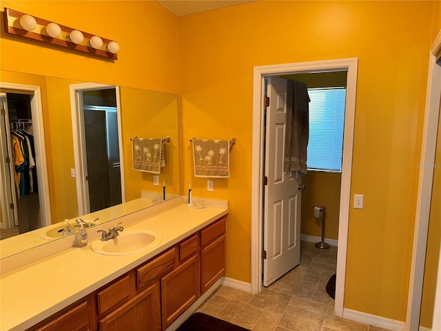 bathroom featuring vanity and a shower with shower door