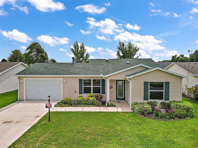 ranch-style house featuring a front lawn and a garage