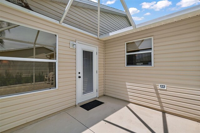 doorway to property featuring a patio