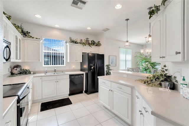 kitchen featuring black appliances, sink, light tile patterned flooring, and white cabinetry