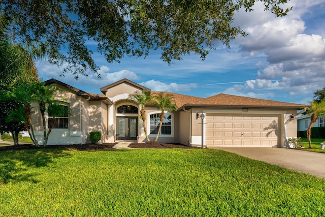 single story home with french doors, a front lawn, and a garage