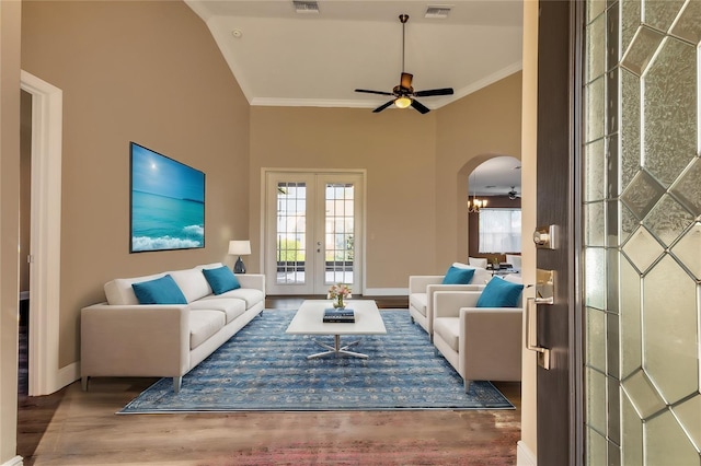 living room with ceiling fan, french doors, ornamental molding, and hardwood / wood-style flooring