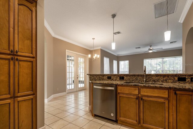 kitchen with pendant lighting, dark stone counters, french doors, sink, and stainless steel dishwasher