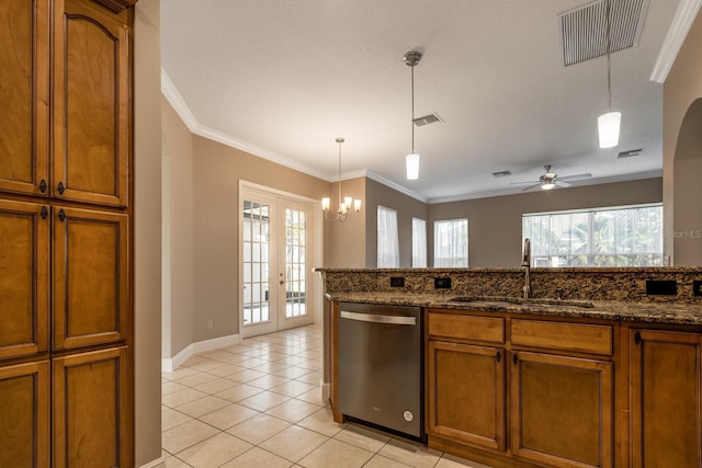27303 Gingerbread Pl, Leesburg, FL 34748 - kitchen featuring dishwasher, a sink, brown cabinetry, ornamental molding, and french doors