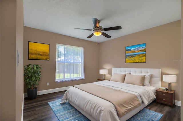 bedroom featuring dark hardwood / wood-style floors and ceiling fan