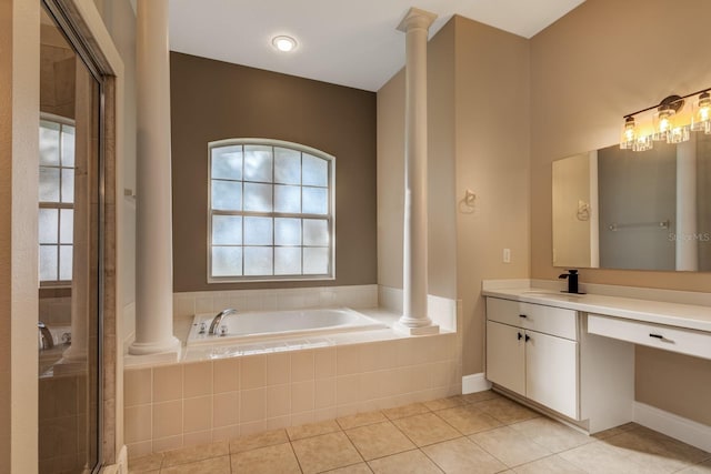 bathroom with tile patterned flooring, vanity, and a wealth of natural light