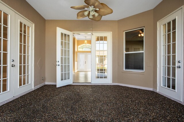 unfurnished sunroom with french doors