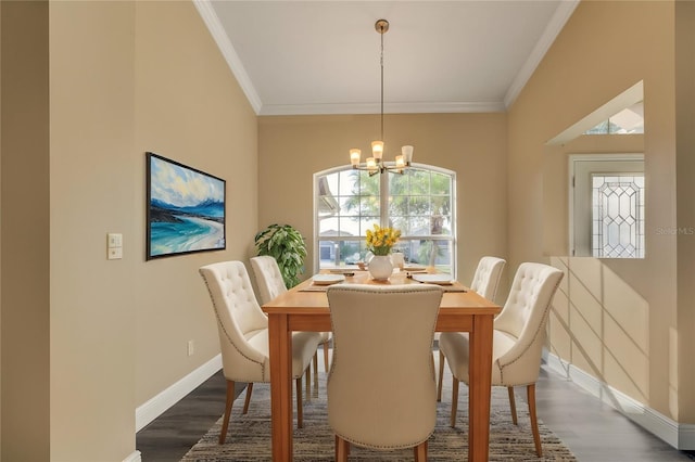 27303 Gingerbread Pl, Leesburg, FL 34748 - dining space with a chandelier, ornamental molding, dark wood finished floors, and baseboards