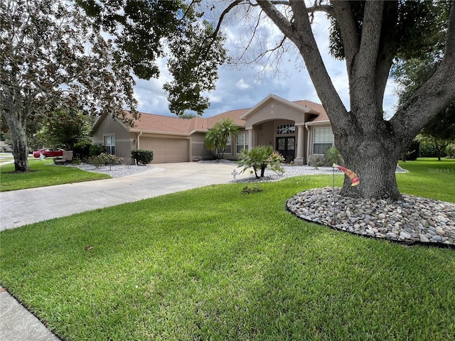 ranch-style house with a garage and a front yard