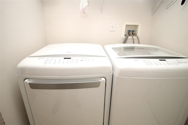 washroom featuring independent washer and dryer