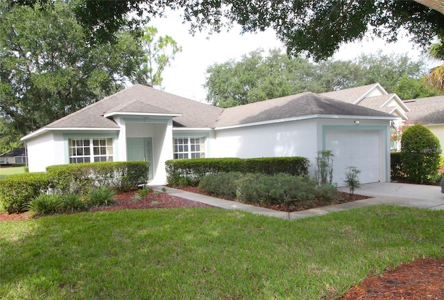 ranch-style house featuring a garage and a front yard