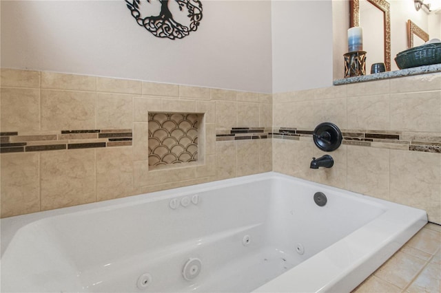 bathroom featuring a whirlpool tub and tile patterned flooring