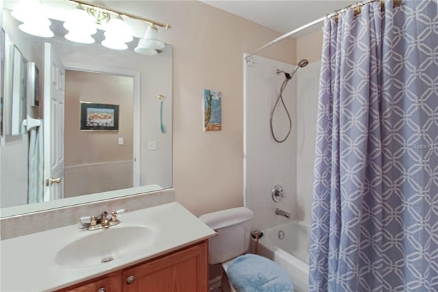 full bathroom with toilet, shower / bath combo with shower curtain, and vanity