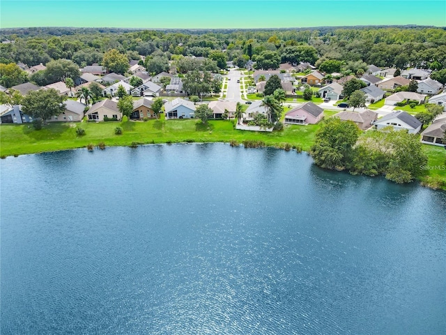 drone / aerial view featuring a residential view and a water view