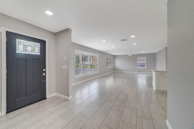 foyer entrance with light wood-type flooring