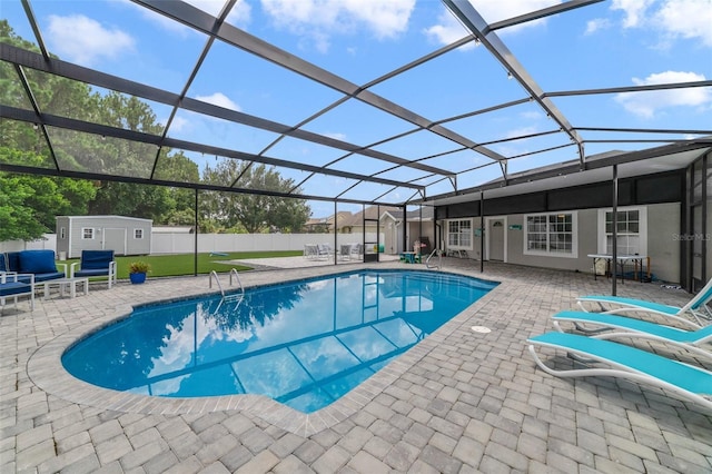 view of swimming pool with glass enclosure and a patio area