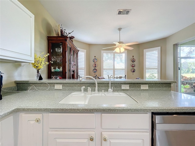 kitchen featuring white cabinets, plenty of natural light, sink, and ceiling fan