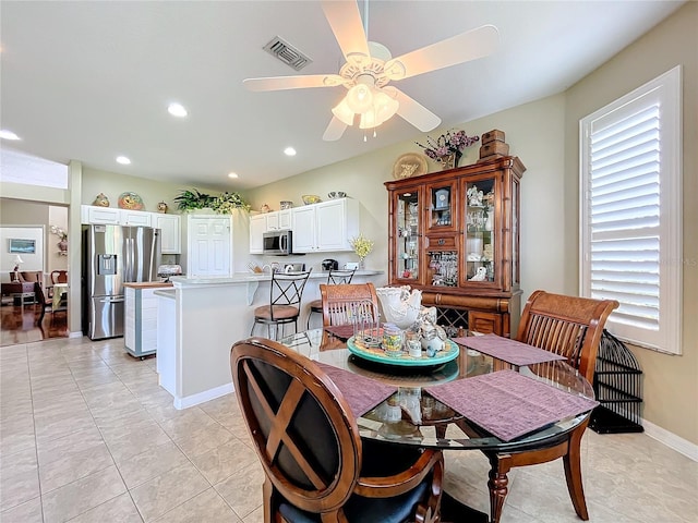 dining room featuring ceiling fan and light tile patterned flooring