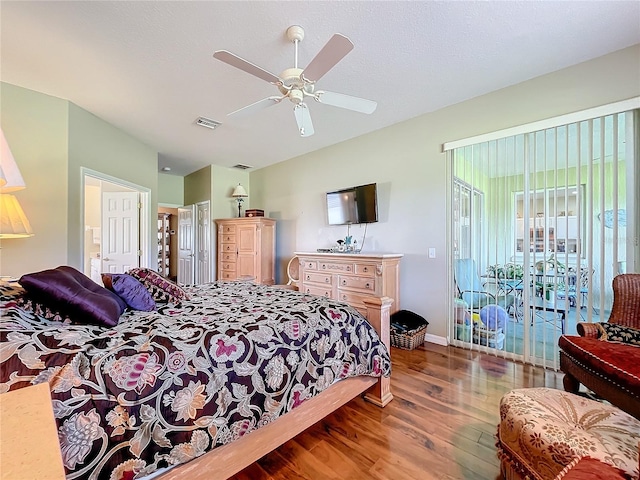 bedroom with ceiling fan, dark hardwood / wood-style flooring, and access to outside