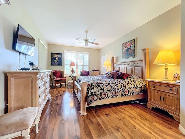 bedroom with ceiling fan and wood-type flooring