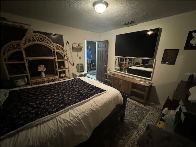 bedroom featuring a textured ceiling