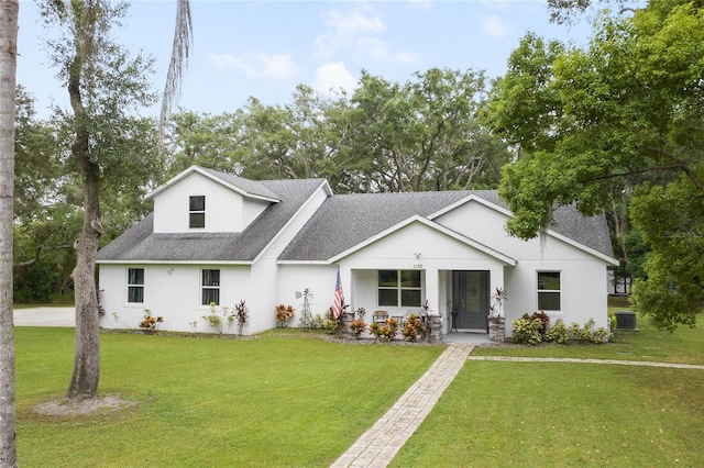 modern farmhouse with central AC unit and a front lawn