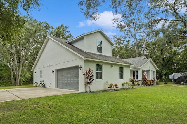 view of front facade with a garage and a front lawn