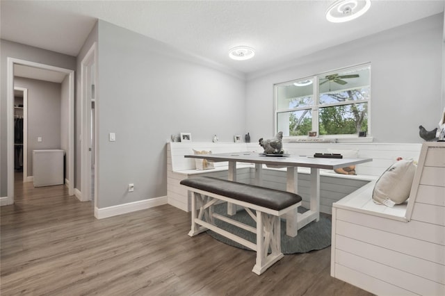 dining space with hardwood / wood-style flooring