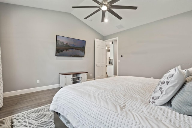 bedroom featuring lofted ceiling, ceiling fan, and hardwood / wood-style flooring