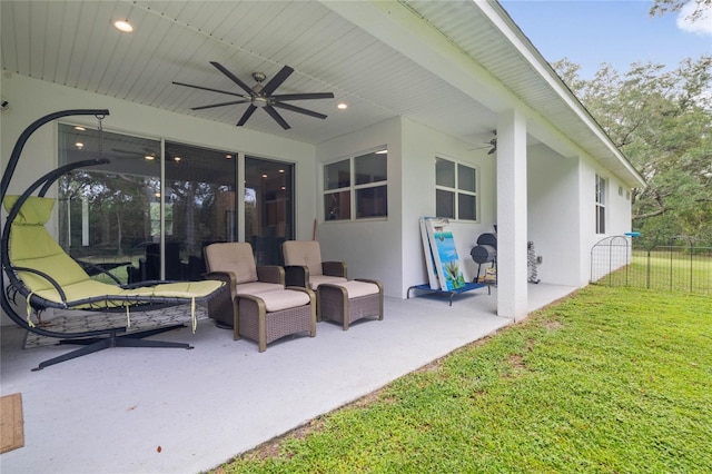 view of patio featuring ceiling fan