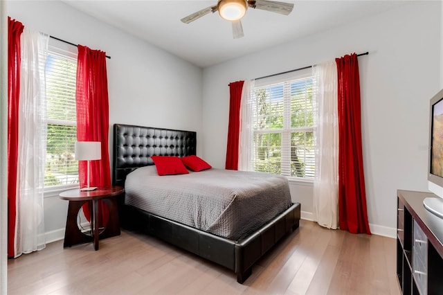 bedroom featuring ceiling fan and hardwood / wood-style floors