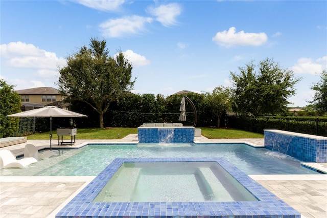 view of pool with a patio and pool water feature