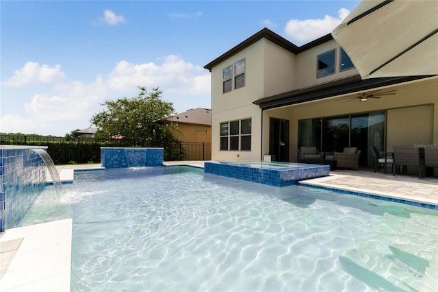 view of swimming pool featuring ceiling fan, a patio area, and pool water feature