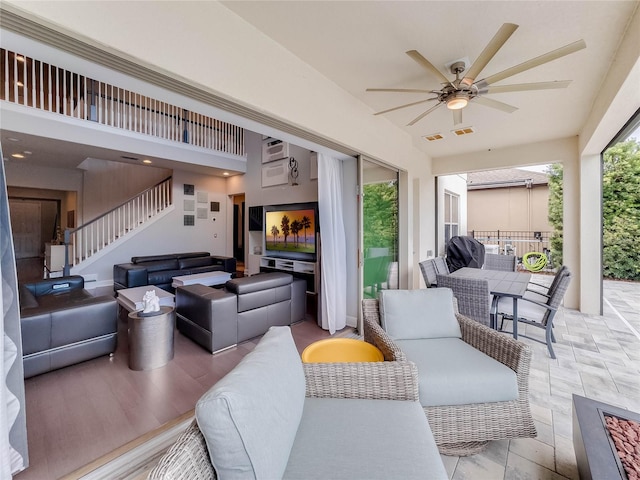 view of patio featuring ceiling fan, an outdoor hangout area, and a balcony