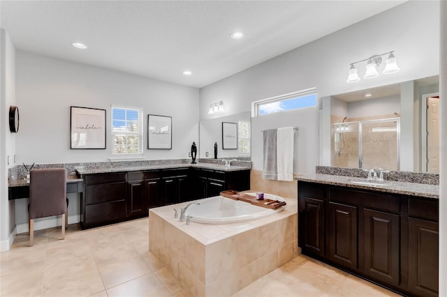 bathroom with tile patterned floors, separate shower and tub, and dual bowl vanity