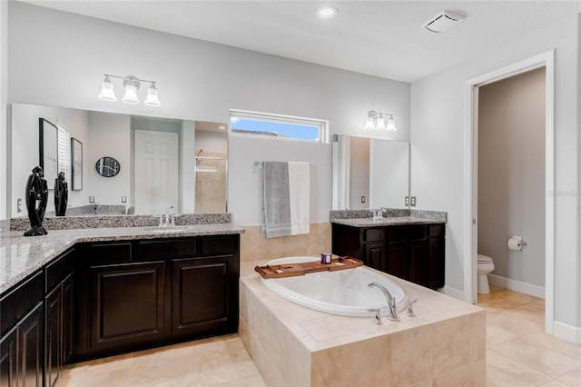 full bathroom with independent shower and bath, vanity, tile patterned floors, and toilet