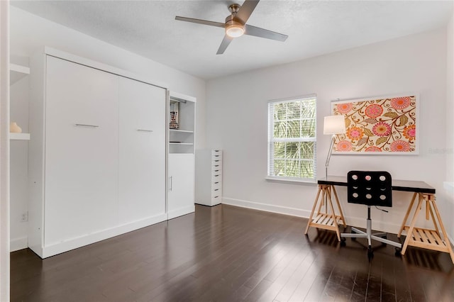 office featuring a textured ceiling, ceiling fan, and hardwood / wood-style flooring