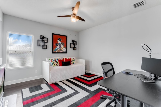 home office featuring ceiling fan and dark hardwood / wood-style flooring