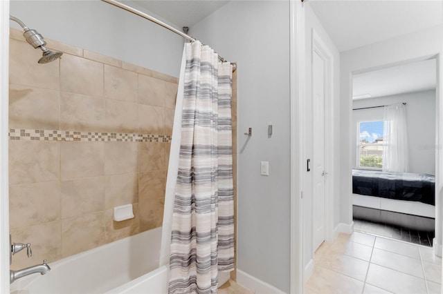 bathroom featuring tile patterned floors and shower / tub combo