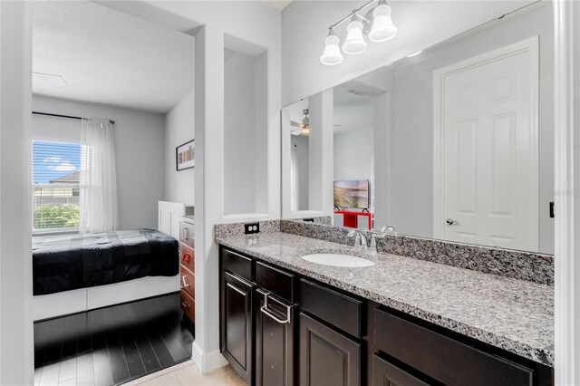 bathroom featuring vanity and ceiling fan