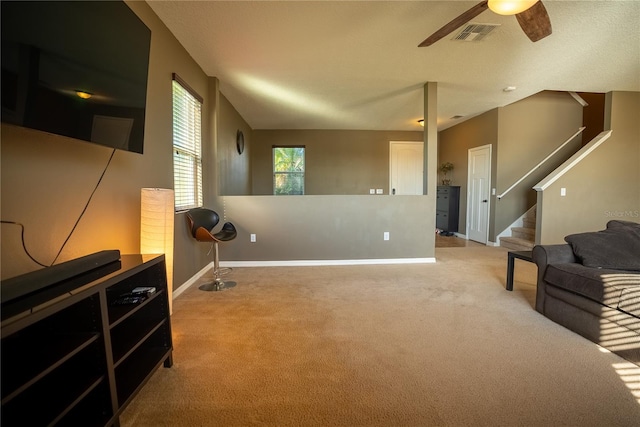 interior space featuring baseboards, stairs, visible vents, and carpet flooring