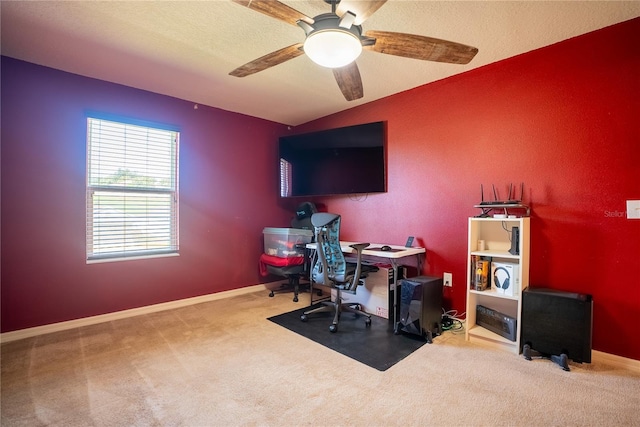 office with a ceiling fan, a textured ceiling, baseboards, and carpet flooring