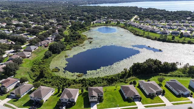 drone / aerial view featuring a residential view and a water view