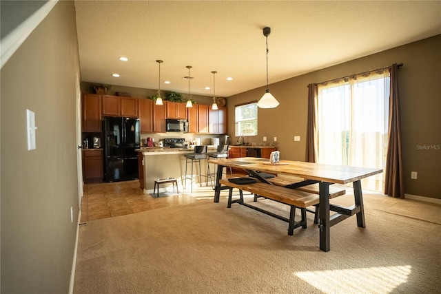 dining room featuring recessed lighting, light carpet, and baseboards