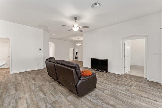 living room featuring light wood-type flooring and ceiling fan