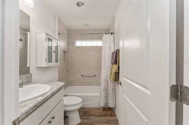 full bathroom with toilet, vanity, shower / bathtub combination with curtain, and wood-type flooring