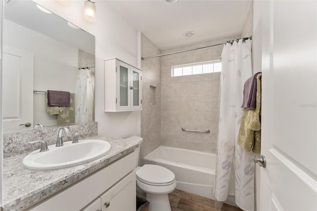 full bathroom with vanity, toilet, shower / bath combo, and hardwood / wood-style floors