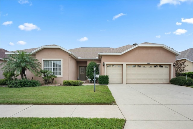 ranch-style house featuring a garage and a front yard